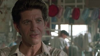 Movie still from “The Legend of Billie Jean” (1985), directed by Matthew Robbins – A person wearing a shirt; Close Up shot, Over the shoulder angle