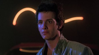 Movie still from “The Legend of Billie Jean” (1985), directed by Matthew Robbins – A young man is looking into the camera; Close Up shot, Low angle