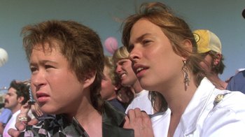 Movie still from “The Legend of Billie Jean” (1985), directed by Matthew Robbins – A group of young people standing next to each other; Close Up shot, Low angle