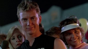 Movie still from “The Legend of Billie Jean” (1985), directed by Matthew Robbins – A person wearing a black shirt; Close Up shot, Low angle