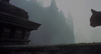Movie still from “The Legend of Hell House” (1973), directed by John Hough – A castle in the middle of a foggy day; Wide shot, Low angle