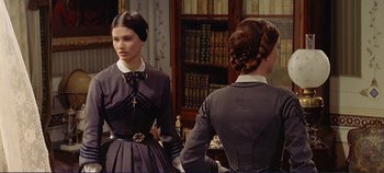 Movie still from “The Leopard” (1963), directed by Luchino Visconti – Two young women are standing in front of a mirror; Medium shot, Over the shoulder angle
