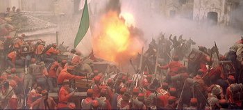 Movie still from “The Leopard” (1963), directed by Luchino Visconti – A group of people in red and green uniforms are fighting; Extreme Wide shot, High angle