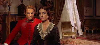 Movie still from “The Leopard” (1963), directed by Luchino Visconti – A man and a woman standing next to each other in a room; Medium shot, Over the shoulder angle
