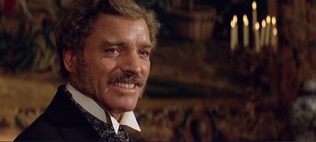 Movie still from “The Leopard” (1963), directed by Luchino Visconti – A person wearing a suit and tie; Close Up shot, Low angle