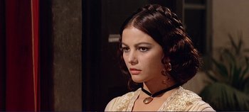 Movie still from “The Leopard” (1963), directed by Luchino Visconti – A beautiful young lady wearing a white dress; Close Up shot, Over the shoulder angle
