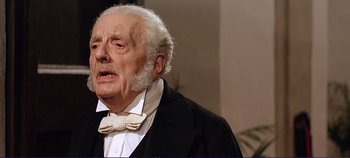 Movie still from “The Leopard” (1963), directed by Luchino Visconti – An old man in a suit and a bow tie; Close Up shot, Low angle