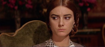 Movie still from “The Leopard” (1963), directed by Luchino Visconti – A person wearing a dress; Close Up shot, Over the shoulder angle