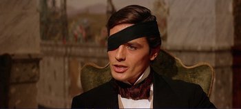 Movie still from “The Leopard” (1963), directed by Luchino Visconti – A man with a blindfold on his head; Close Up shot, High angle
