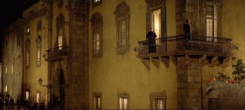 Movie still from “The Leopard” (1963), directed by Luchino Visconti – A man standing on a balcony looking out the window; Extreme Wide shot, Low angle