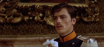 Movie still from “The Leopard” (1963), directed by Luchino Visconti – A man in a uniform holding a pair of scissors; Close Up shot, Low angle