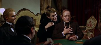 Movie still from “The Leopard” (1963), directed by Luchino Visconti – Two men sitting at a table with cards; Medium shot, Over the shoulder angle