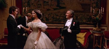 Movie still from “The Leopard” (1963), directed by Luchino Visconti – A man and a woman dressed in formal wear; Medium shot, Low angle