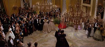 Movie still from “The Leopard” (1963), directed by Luchino Visconti – A group of people dressed in formal wear dancing; Extreme Wide shot, High angle