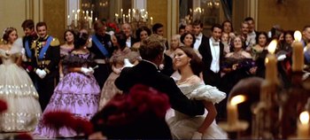 Movie still from “The Leopard” (1963), directed by Luchino Visconti – A man and a woman dancing in front of a crowd; Medium shot, Low angle