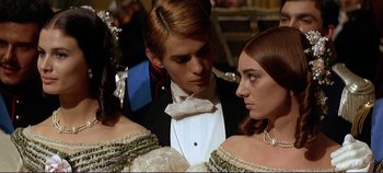 Movie still from “The Leopard” (1963), directed by Luchino Visconti – A man and a woman in formal wear standing next to each other; Close Up shot, Over the shoulder angle