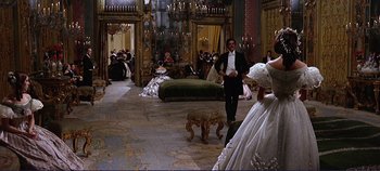 Movie still from “The Leopard” (1963), directed by Luchino Visconti – A group of people sitting in a living room; Wide shot, High angle