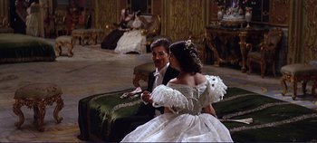 Movie still from “The Leopard” (1963), directed by Luchino Visconti – A man and a woman dressed in a wedding dress; Wide shot, Over the shoulder angle
