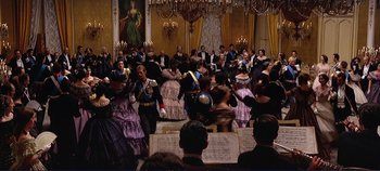 Movie still from “The Leopard” (1963), directed by Luchino Visconti – A group of people dressed in period costumes; Wide shot, High angle