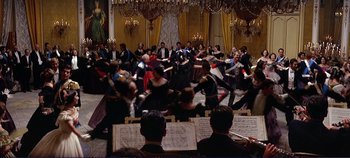 Movie still from “The Leopard” (1963), directed by Luchino Visconti – A large group of people dancing in a room; Wide shot, High angle