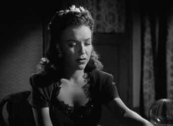 Movie still from “The Leopard Man” (1943), directed by Jacques Tourneur – A black - and - white photo of a woman in a black dress; Close Up shot, Low angle