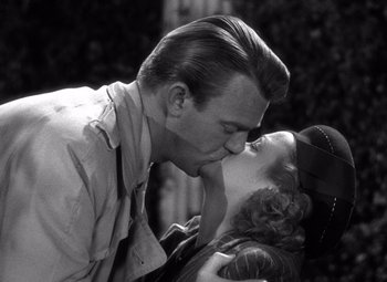 Movie still from “The Leopard Man” (1943), directed by Jacques Tourneur – A man and a woman kissing each other; Close Up shot, Low angle