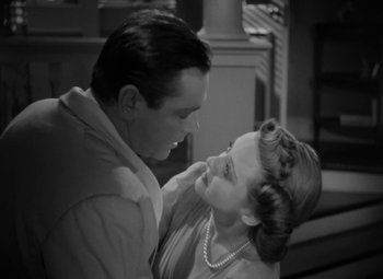 Movie still from “The Letter” (1940), directed by William Wyler – A man and a woman are looking into each others eyes; Close Up shot, High angle