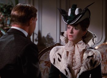 Movie still from “The Life and Death of Colonel Blimp” (1943), directed by Emeric Pressburger – A man and a woman wearing a hat and a suit; Close Up shot, Over the shoulder angle