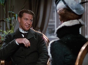 Movie still from “The Life and Death of Colonel Blimp” (1943), directed by Emeric Pressburger – A man in a suit and a woman in a black coat; Medium shot, Over the shoulder angle