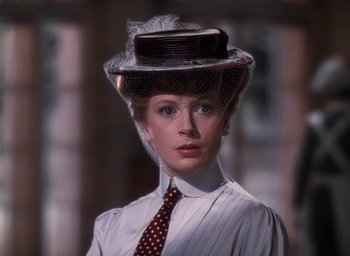 Movie still from “The Life and Death of Colonel Blimp” (1943), directed by Emeric Pressburger – A woman wearing a hat with a veil on top; Close Up shot, Over the shoulder angle