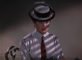 Movie still from “The Life and Death of Colonel Blimp” (1943), directed by Emeric Pressburger – A woman wearing a top hat and a tie; Close Up shot, Low angle