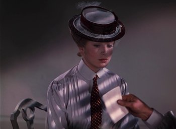 Movie still from “The Life and Death of Colonel Blimp” (1943), directed by Emeric Pressburger – A woman wearing a top hat and a tie; Close Up shot, Low angle