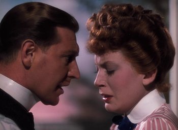 Movie still from “The Life and Death of Colonel Blimp” (1943), directed by Emeric Pressburger – A man and a woman face to face in front of each other; Close Up shot, Over the shoulder angle