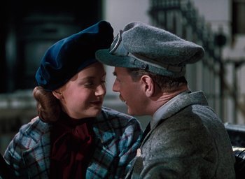 Movie still from “The Life and Death of Colonel Blimp” (1943), directed by Emeric Pressburger – A man and a woman are looking at one another; Medium shot, High angle