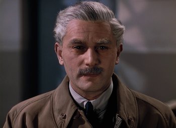 Movie still from “The Life and Death of Colonel Blimp” (1943), directed by Emeric Pressburger – An older man with a mustache wearing a brown jacket; Close Up shot, High angle