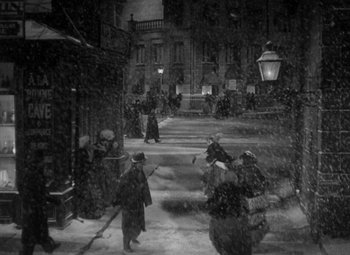 Movie still from “The Life of Emile Zola” (1937), directed by William Dieterle – A black and white photo of people walking in the snow; Extreme Wide shot, High angle