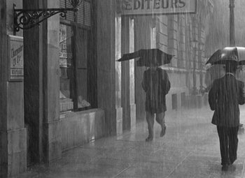 Movie still from “The Life of Emile Zola” (1937), directed by William Dieterle – Two people walking down the street in the pouring rain; Wide shot, High angle