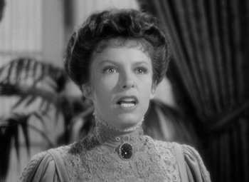 Movie still from “The Life of Emile Zola” (1937), directed by William Dieterle – An old photo of a woman in a victorian dress; Close Up shot, Low angle