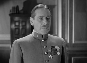 Movie still from “The Life of Emile Zola” (1937), directed by William Dieterle – A man in a military uniform with medals around his neck; Close Up shot, Low angle