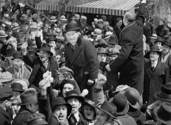 Movie still from “The Life of Emile Zola” (1937), directed by William Dieterle – An old photo of a group of people in a crowd; Wide shot, High angle
