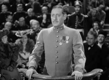 Movie still from “The Life of Emile Zola” (1937), directed by William Dieterle – A man in a military uniform standing in front of a crowd; Medium shot, Low angle