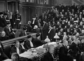 Movie still from “The Life of Emile Zola” (1937), directed by William Dieterle – An old photo of a court room filled with people; Extreme Wide shot, High angle