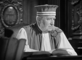 Movie still from “The Life of Emile Zola” (1937), directed by William Dieterle – An older man wearing a hat and a robe; Close Up shot, High angle