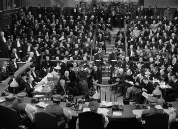 Movie still from “The Life of Emile Zola” (1937), directed by William Dieterle – An old photo of a group of people sitting at a table; Extreme Wide shot, High angle