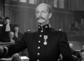 Movie still from “The Life of Emile Zola” (1937), directed by William Dieterle – An old man in a military uniform with a mustache; Close Up shot, Low angle