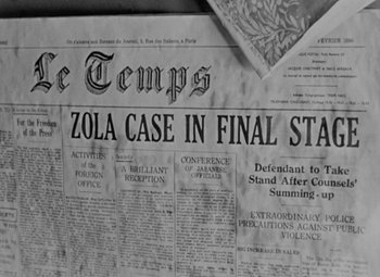 Movie still from “The Life of Emile Zola” (1937), directed by William Dieterle – An old newspaper with the front page of a newspaper with the headline zola case in final stage; Extreme Close Up shot, High angle