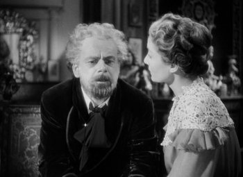 Movie still from “The Life of Emile Zola” (1937), directed by William Dieterle – An older man and a young woman in a room; Medium shot, Over the shoulder angle