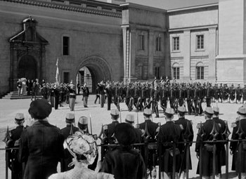 Movie still from “The Life of Emile Zola” (1937), directed by William Dieterle – A black and white photo of a military parade; Extreme Wide shot, High angle