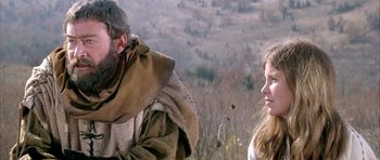 Movie still from “The Lion in Winter” (1968), directed by Anthony Harvey – A man and a woman are talking in a field; Medium shot, Low angle