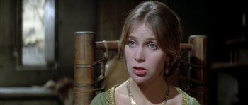 Movie still from “The Lion in Winter” (1968), directed by Anthony Harvey – A young woman in a green dress looking at the camera; Close Up shot, Over the shoulder angle